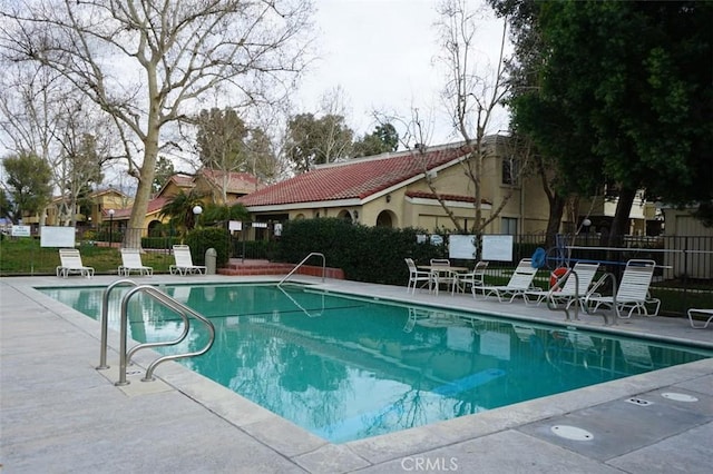 view of pool featuring a patio