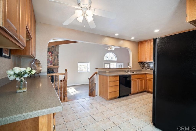 kitchen featuring light tile patterned floors, tasteful backsplash, ceiling fan, and black appliances