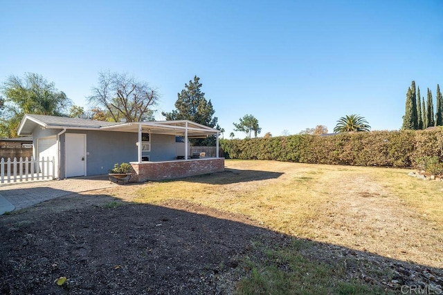 exterior space featuring a front yard and a garage