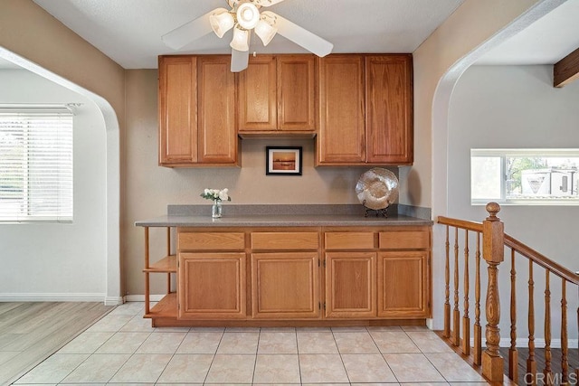 kitchen featuring light tile patterned floors and ceiling fan