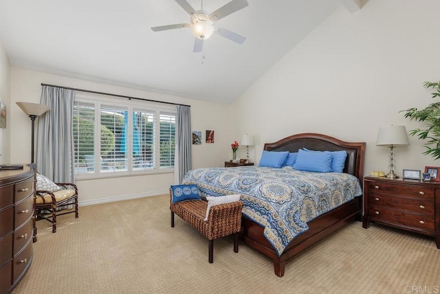 carpeted bedroom with ceiling fan and lofted ceiling