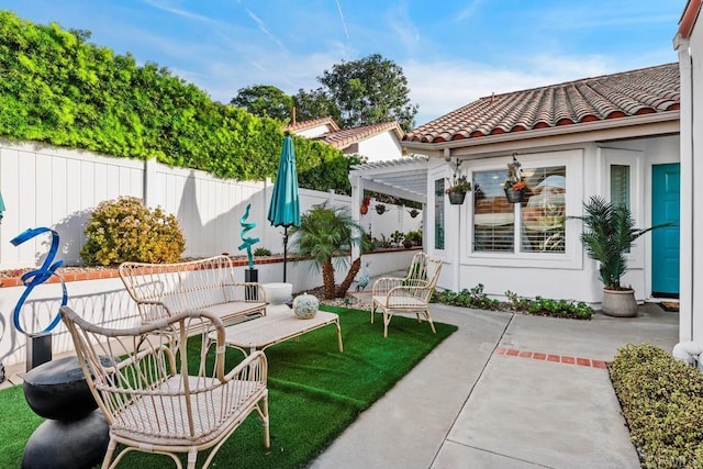 view of patio with an outdoor hangout area and a pergola