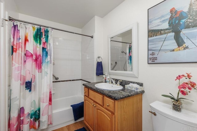 full bathroom featuring toilet, shower / bath combo, hardwood / wood-style flooring, and vanity