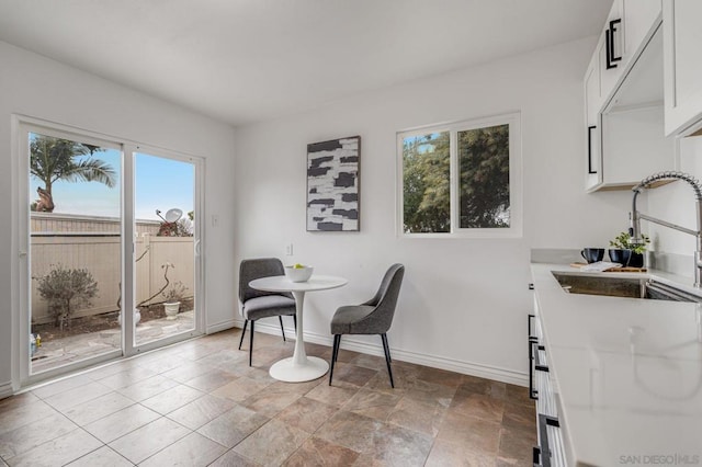 dining space featuring sink