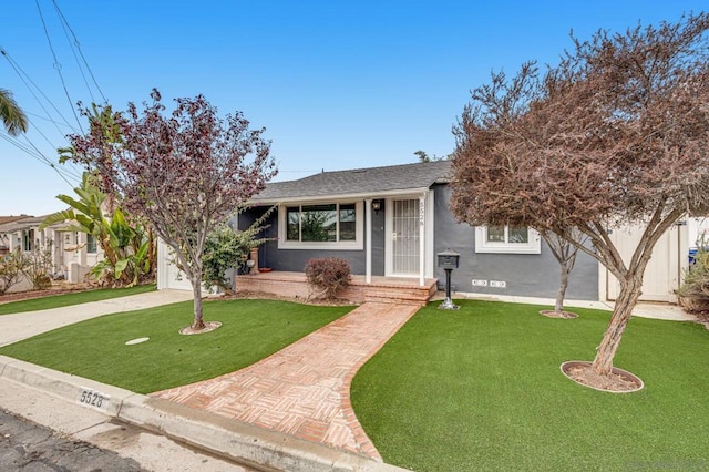 view of front facade with a front lawn and a garage