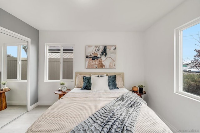 bedroom featuring multiple windows