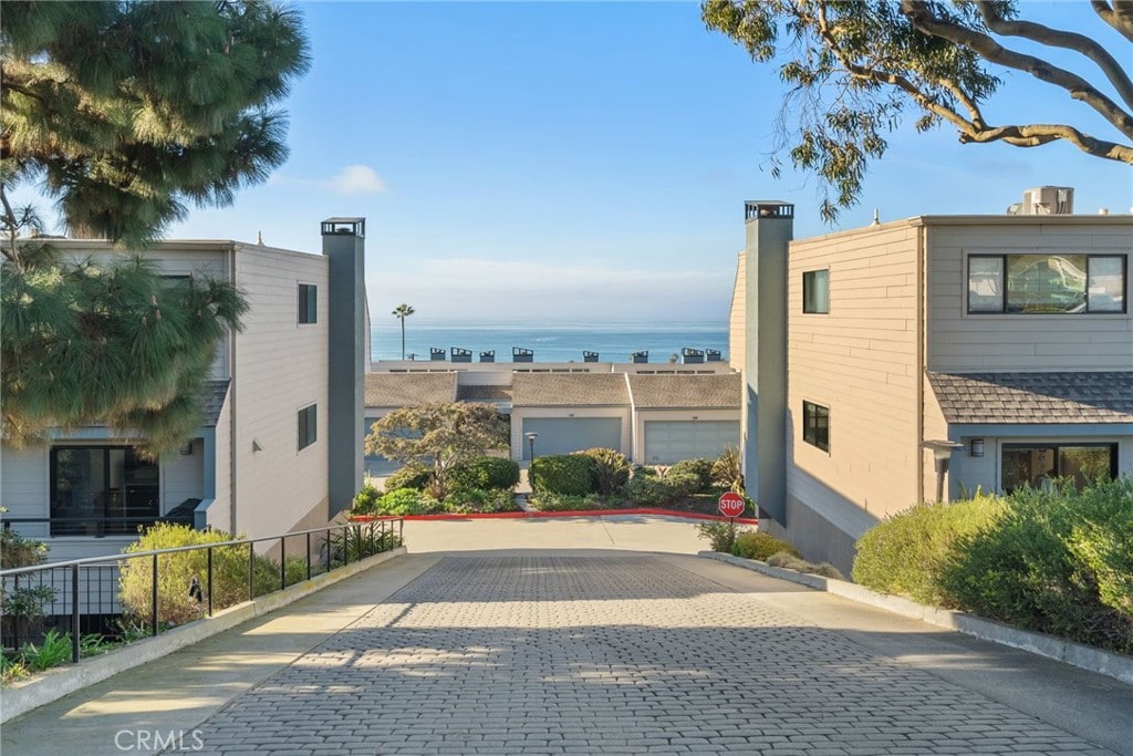 view of home's exterior with a water view