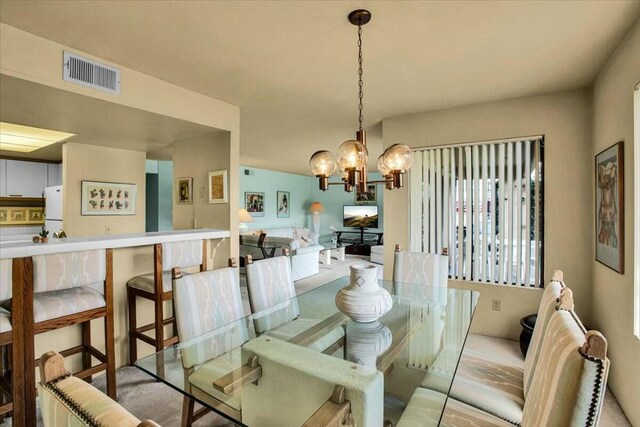 dining area featuring a chandelier