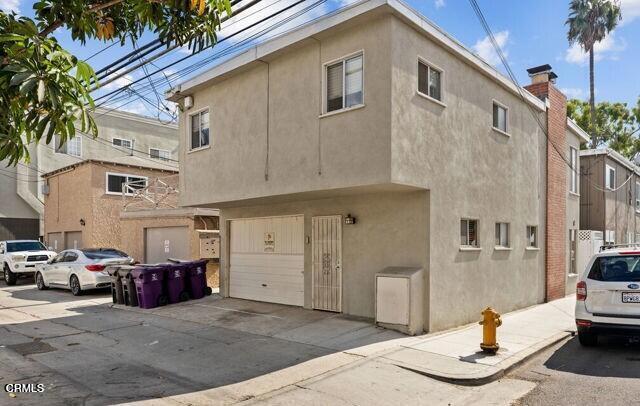 back of property featuring a garage