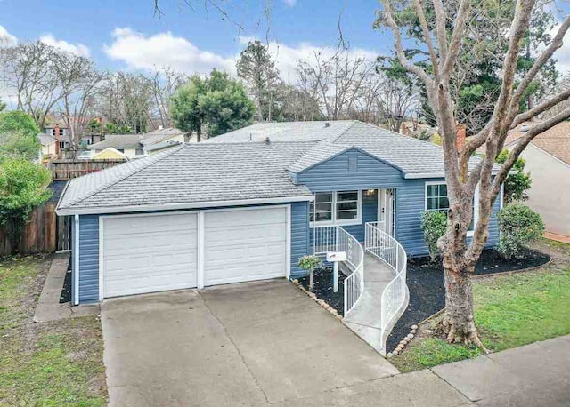 single story home featuring a garage