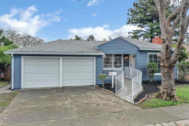 single story home with a garage and covered porch