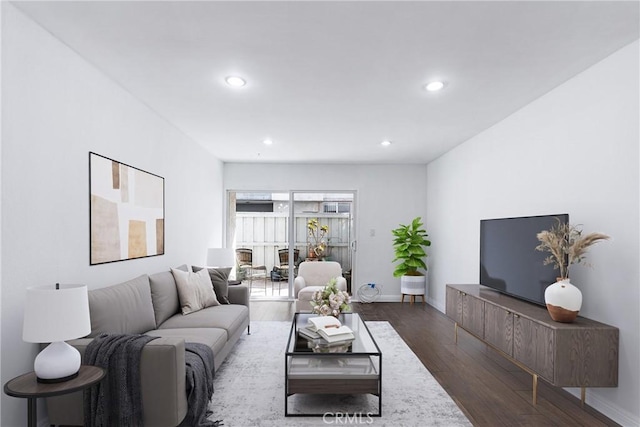 living room featuring dark wood-type flooring