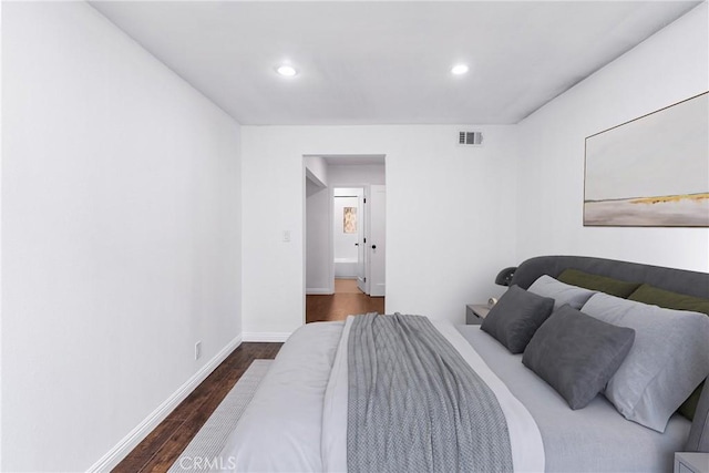 bedroom featuring dark hardwood / wood-style floors