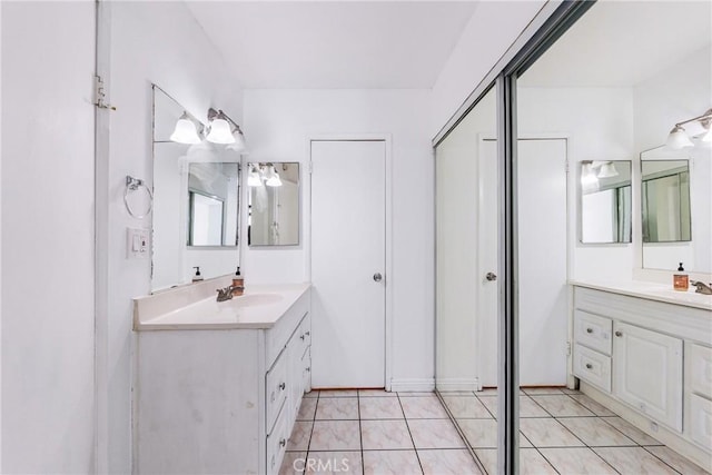 bathroom with tile patterned floors and vanity