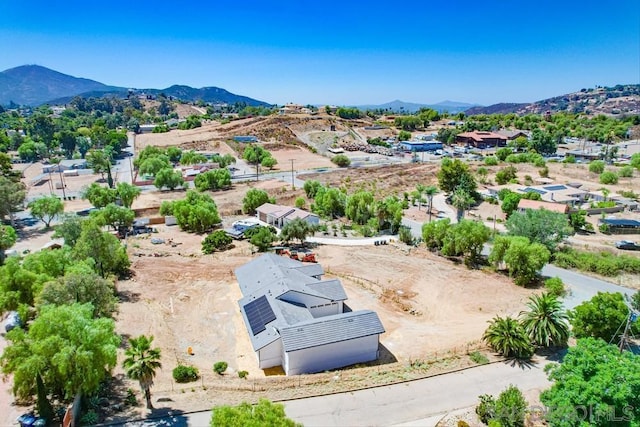 birds eye view of property featuring a mountain view