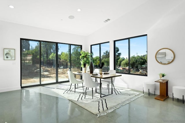 unfurnished dining area with concrete flooring