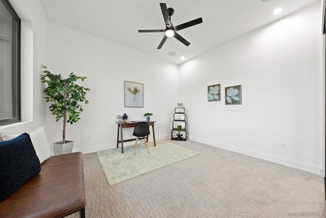 interior space with carpet floors and ceiling fan