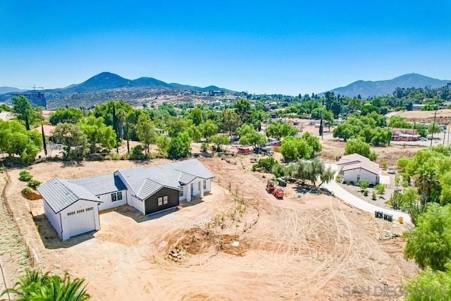 birds eye view of property featuring a mountain view