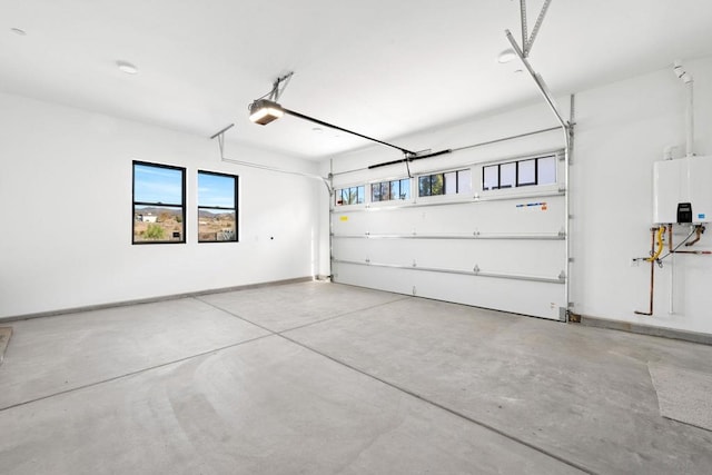 garage with water heater and a garage door opener