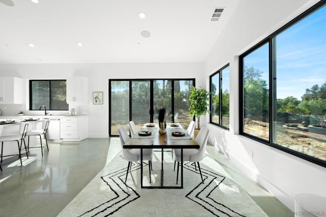 interior space featuring vaulted ceiling and sink