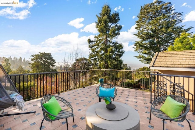 view of patio with a balcony