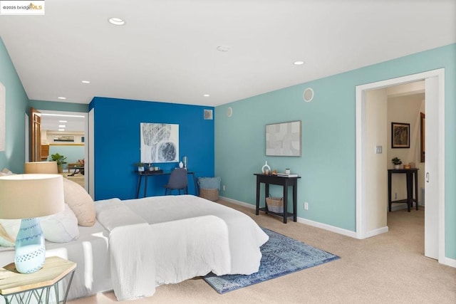 bedroom featuring light carpet