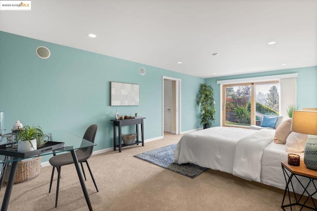 bedroom featuring light carpet