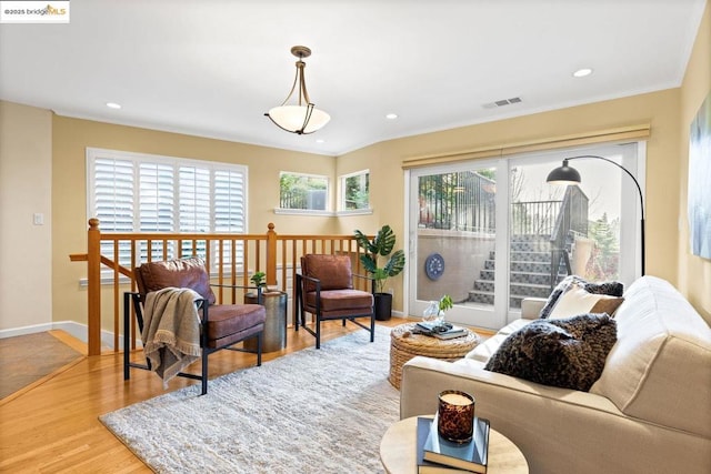 living room with a wealth of natural light and hardwood / wood-style floors