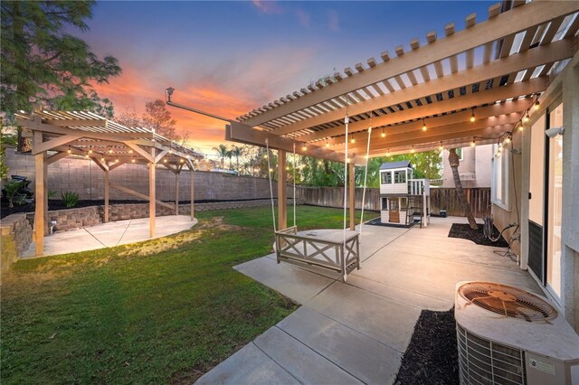 yard at dusk featuring a pergola, a patio area, and cooling unit