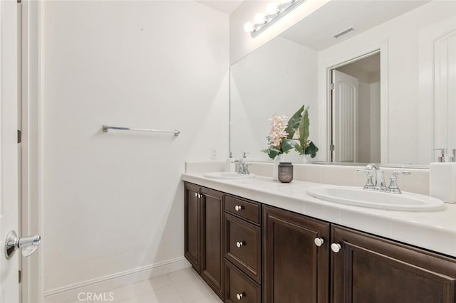 bathroom with vanity and tile patterned flooring