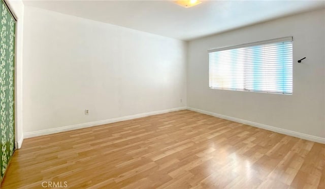 empty room with light hardwood / wood-style floors