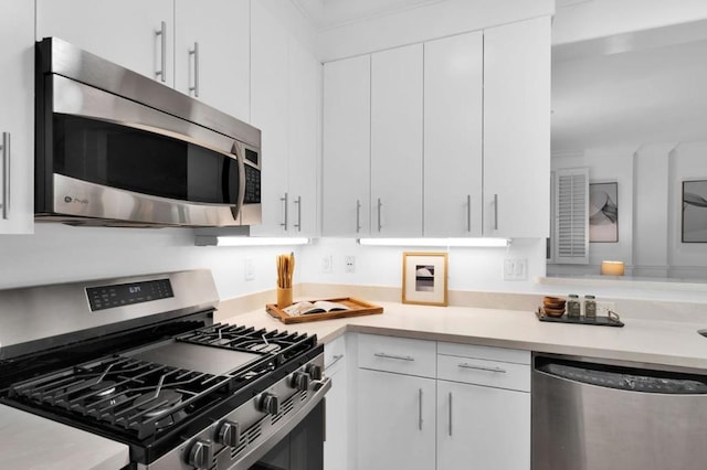 kitchen featuring white cabinets and appliances with stainless steel finishes