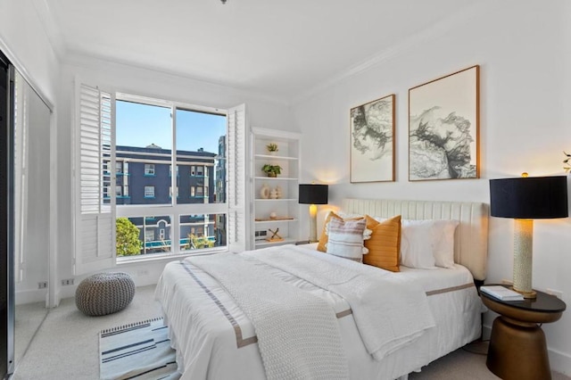 bedroom featuring carpet floors, a closet, and ornamental molding