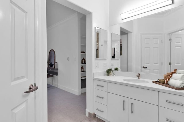 bathroom with vanity and ornamental molding