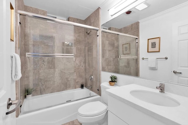 full bathroom with toilet, vanity, ornamental molding, and combined bath / shower with glass door