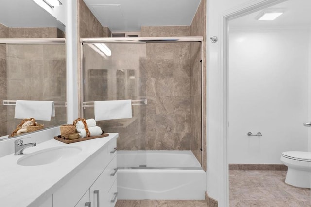 full bathroom with toilet, tile patterned flooring, enclosed tub / shower combo, and vanity