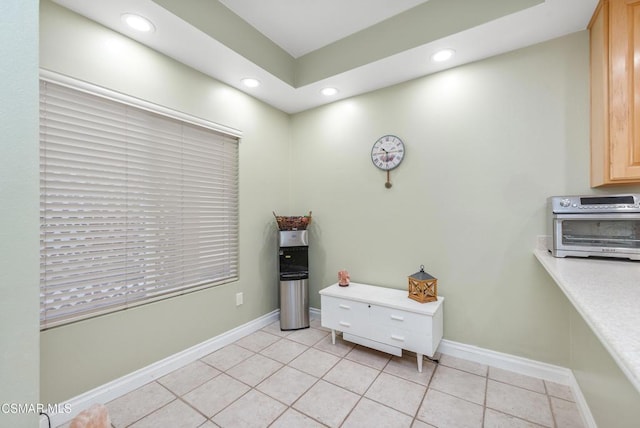 miscellaneous room with light tile patterned floors