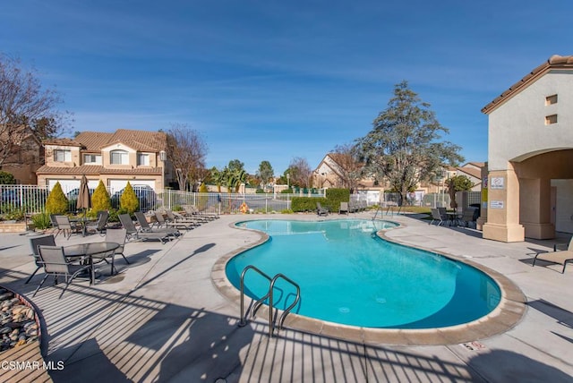 view of swimming pool with a patio area