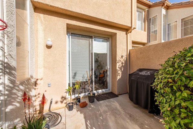 doorway to property featuring a patio area