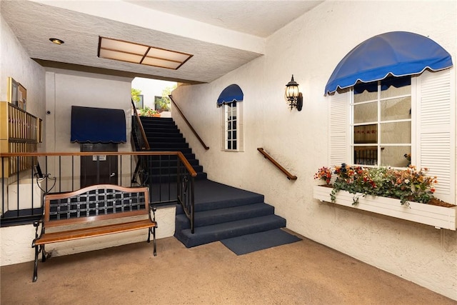 stairs featuring carpet