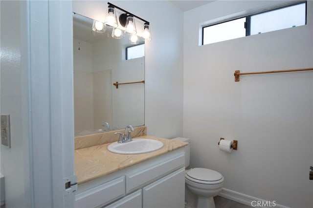 bathroom with toilet and vanity