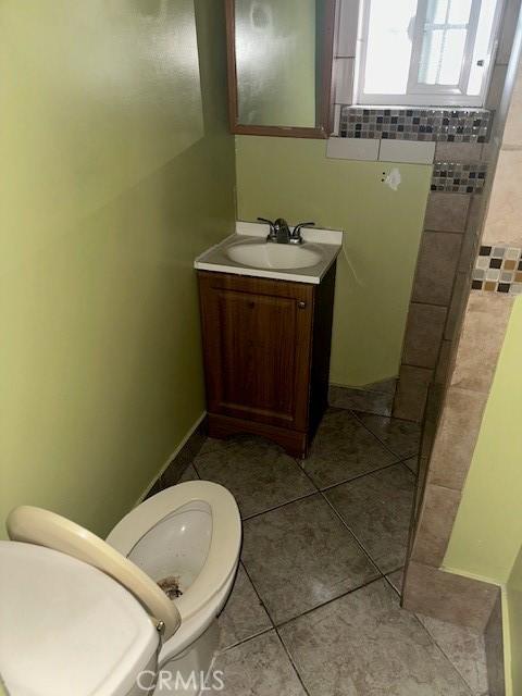 bathroom with toilet and vanity