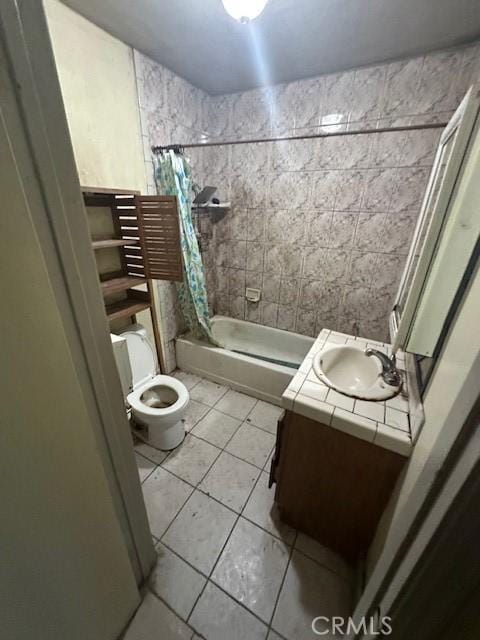 full bathroom with toilet, shower / tub combo, tile patterned flooring, and vanity