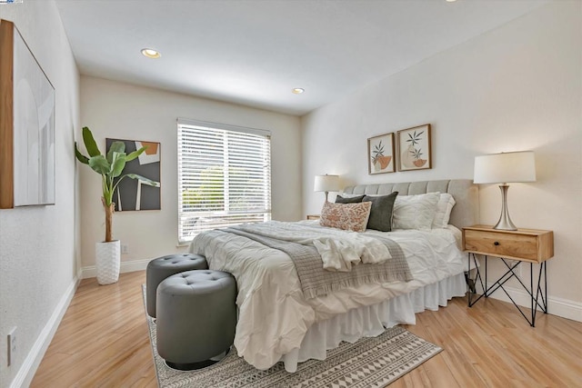 bedroom with hardwood / wood-style flooring