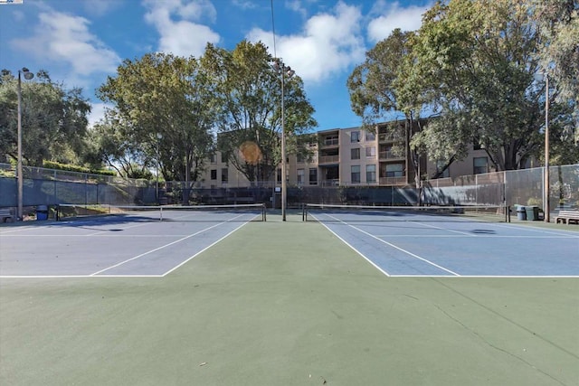 view of sport court with basketball hoop