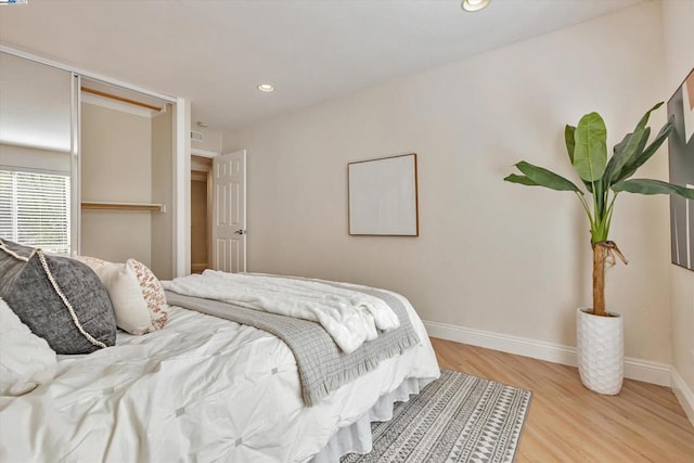 bedroom with light hardwood / wood-style flooring