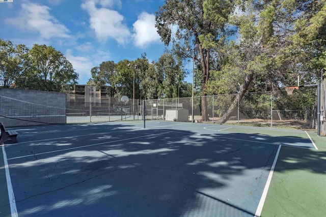 view of tennis court featuring basketball court