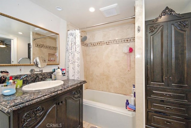 bathroom featuring shower / tub combo and vanity