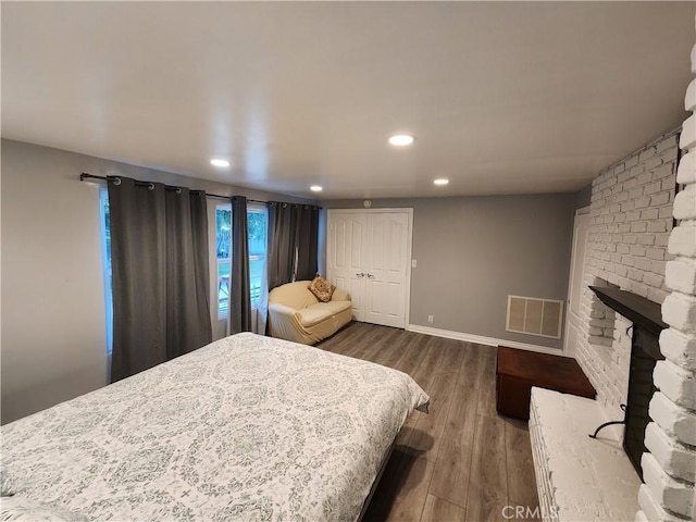 bedroom featuring hardwood / wood-style flooring and a closet