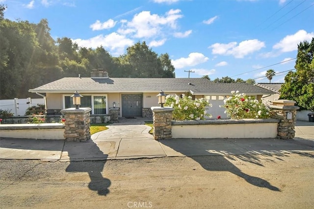 ranch-style home featuring a garage